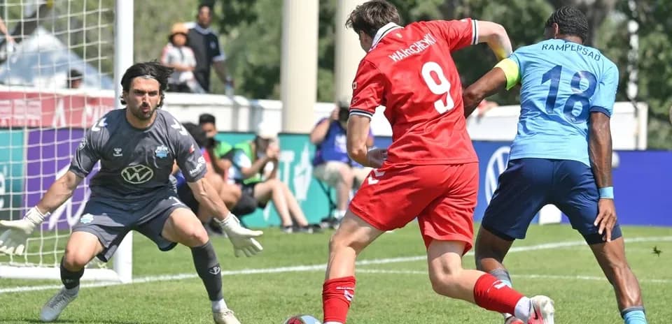 Player shooting on goal during match action
