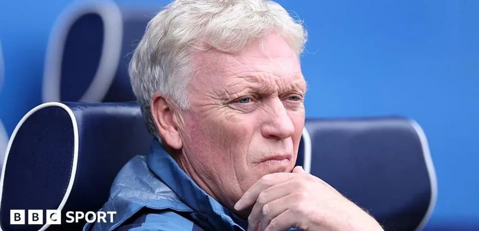 Manager seated on bench during match observation