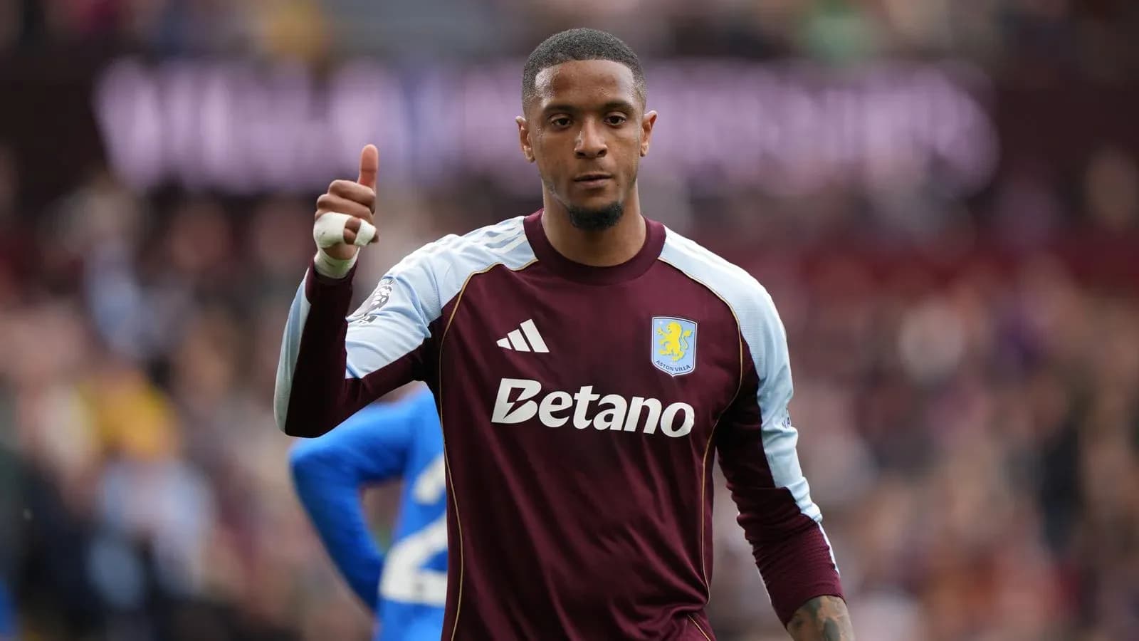 Goalkeeper giving thumbs up during match