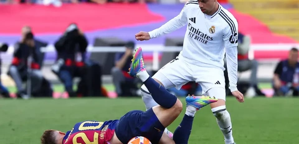 Barcelona player falling during El Clasico match