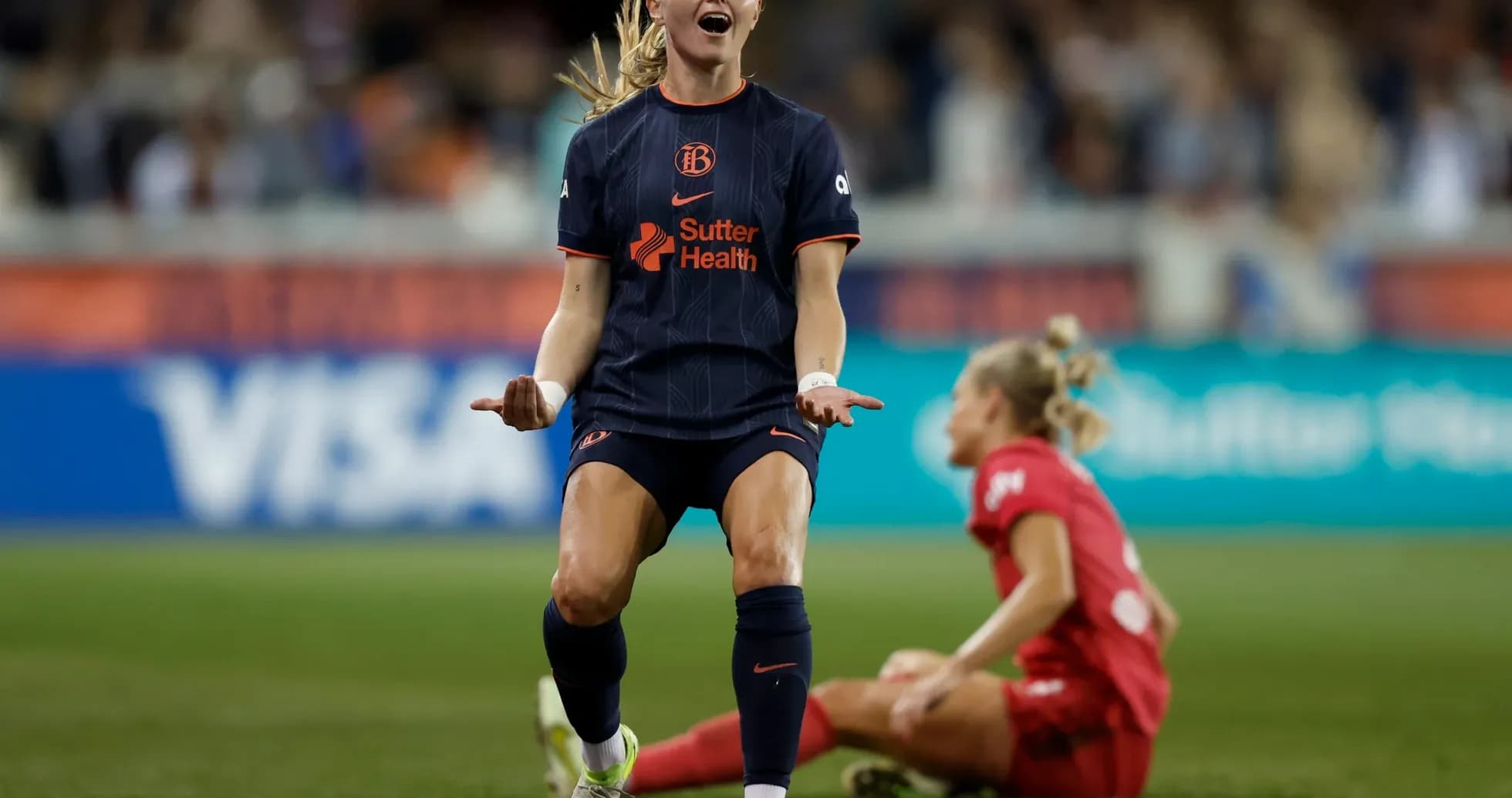 Player celebrating during NWSL match