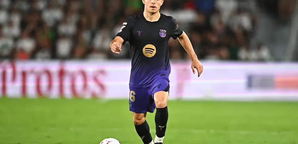 Player dribbling the ball on the field