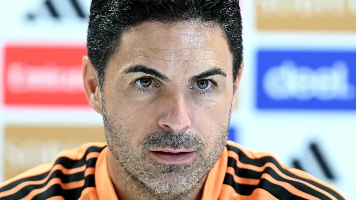 Manager speaking at press conference with serious expression
