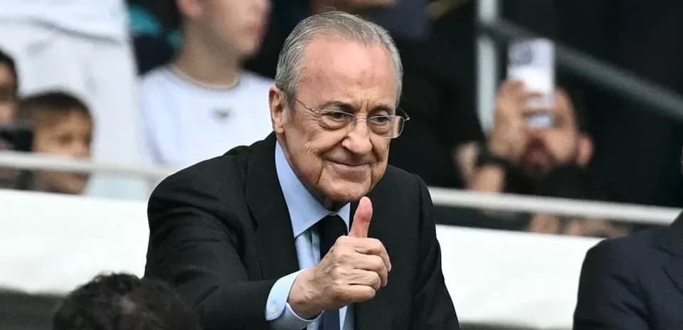 Man giving thumbs up in stadium seating area