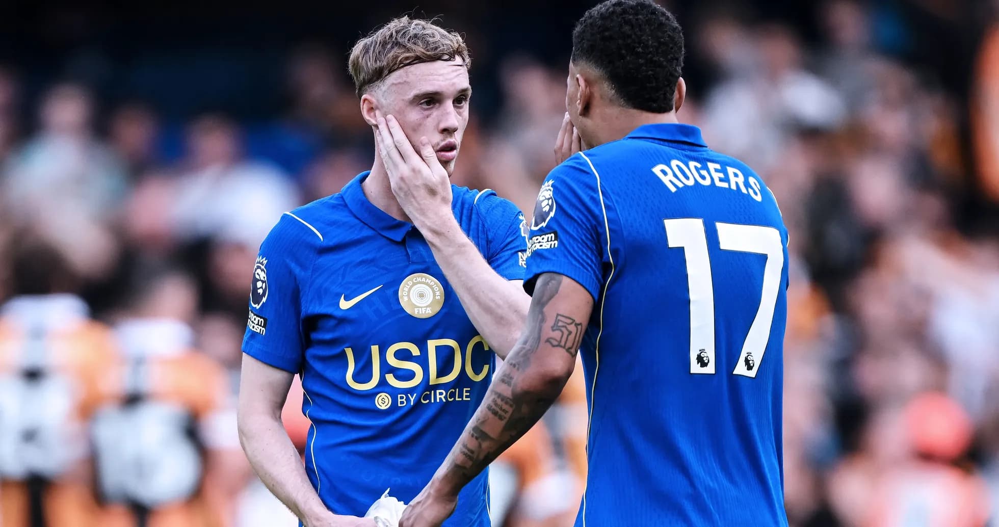 Two players discussing on the pitch after match