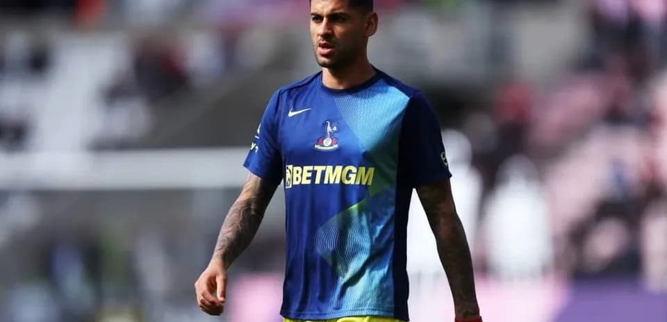 Player in training kit walking on the pitch