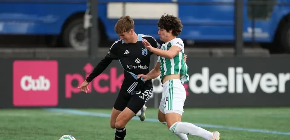 Players competing for the ball during match
