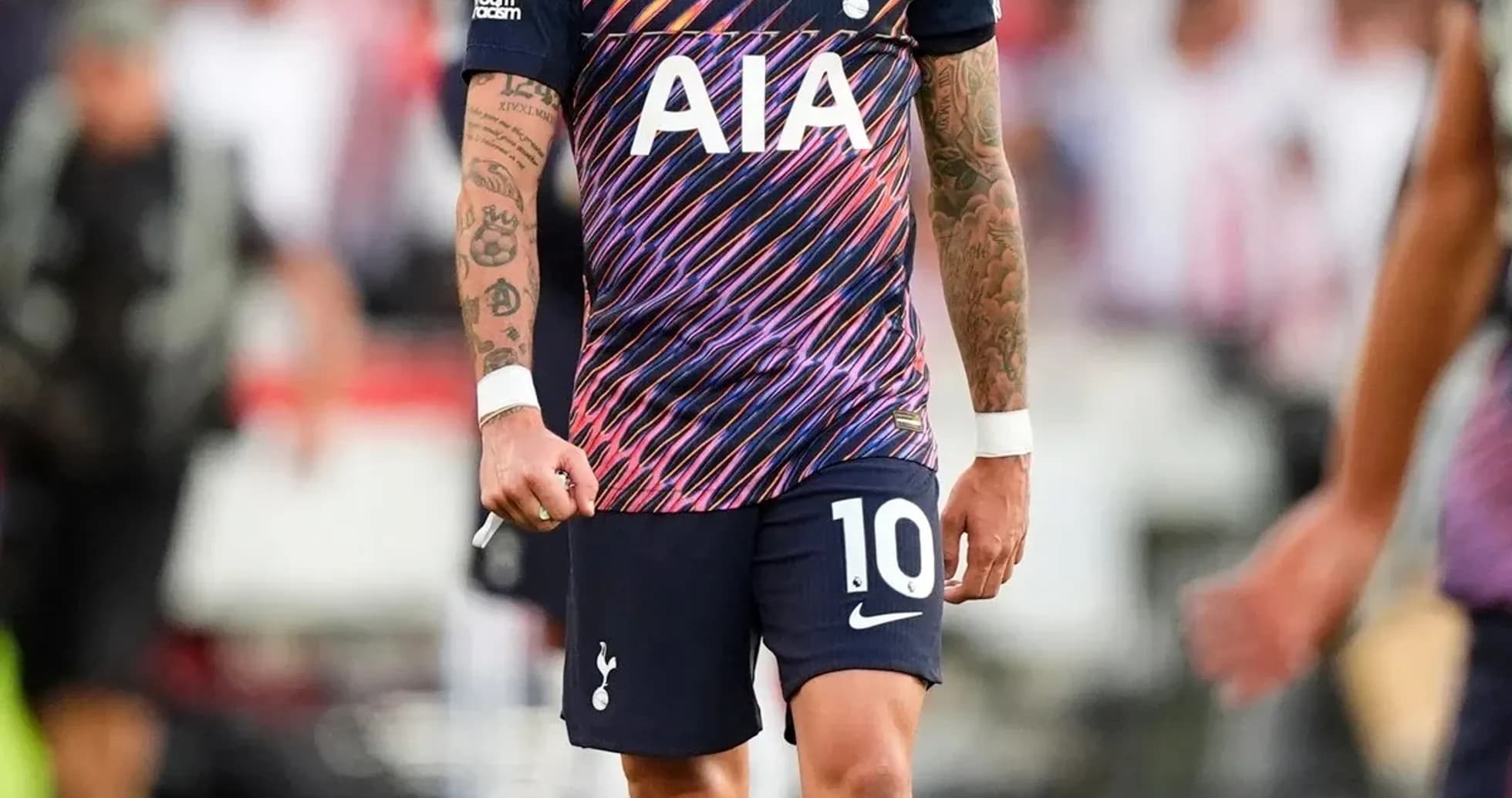 Player wearing Tottenham kit on the pitch