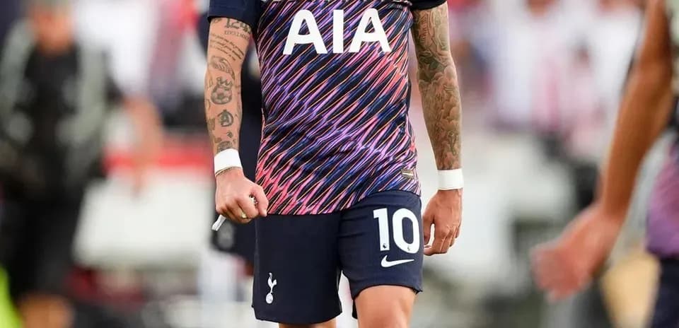 Player wearing Tottenham kit on the pitch