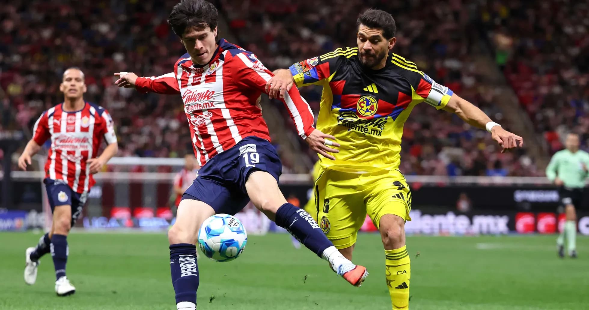 Club America player challenging Guadalajara Chivas player