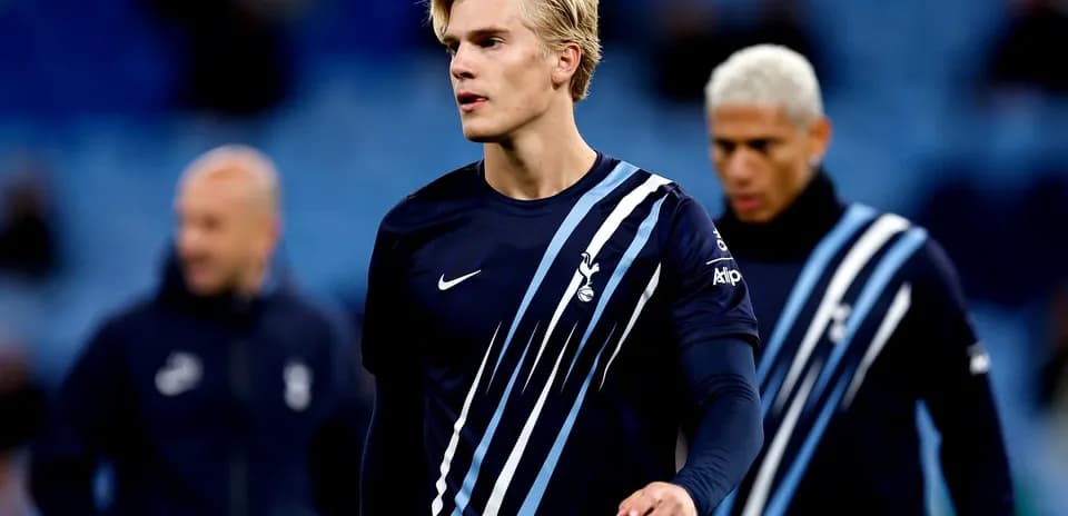 Player walking on pitch before match warm-up