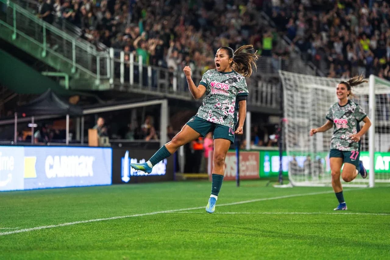 Player celebrating goal during Seattle Reign match