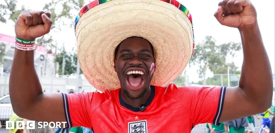 Fan wearing sombrero celebrating before a match