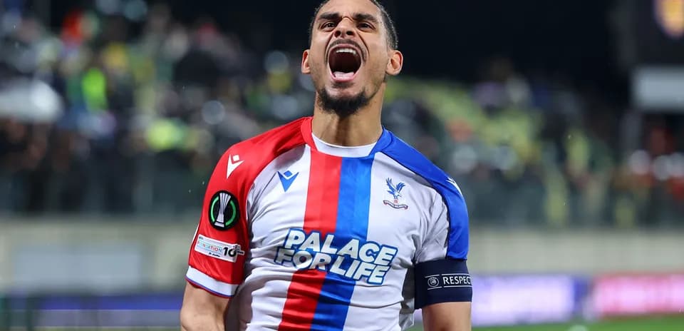 Player celebrating passionately in Crystal Palace kit