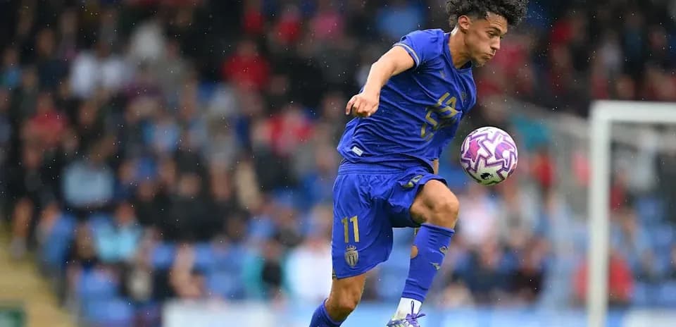 Player in blue jersey controlling ball during match
