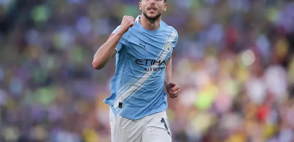 Player celebrating after scoring for Manchester City
