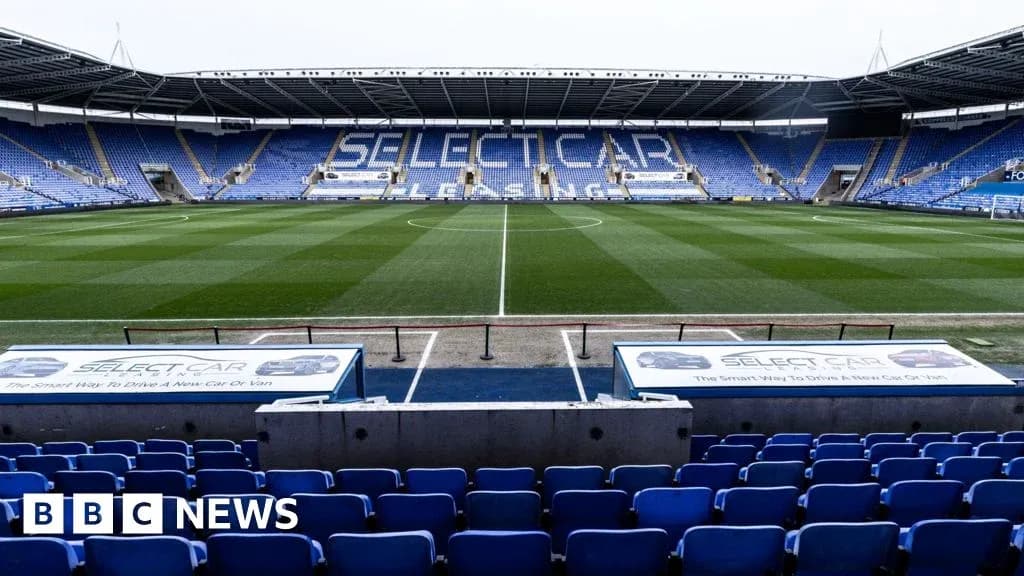 Empty stadium seats and pitch at Select Car Leasing Stadium