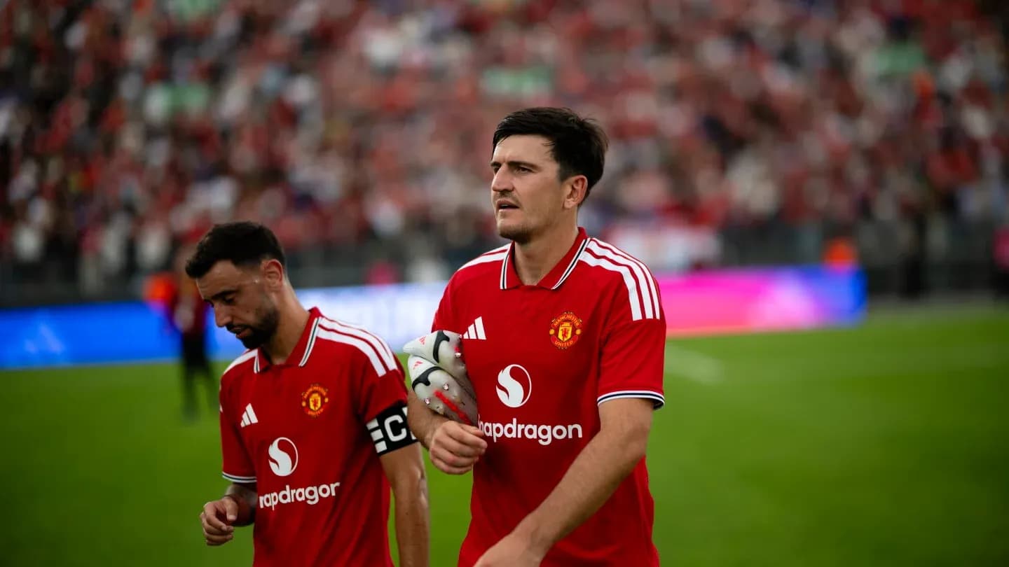 Bruno Fernandes and Harry Maguire walking off the pitch