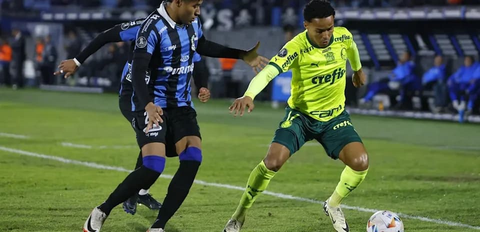 Two players contesting for the ball during match