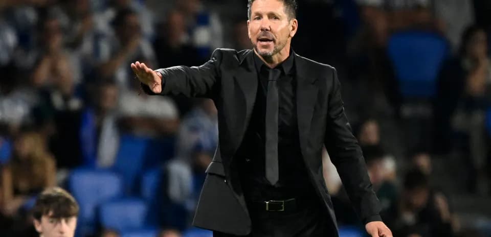Coach giving instructions during a football match