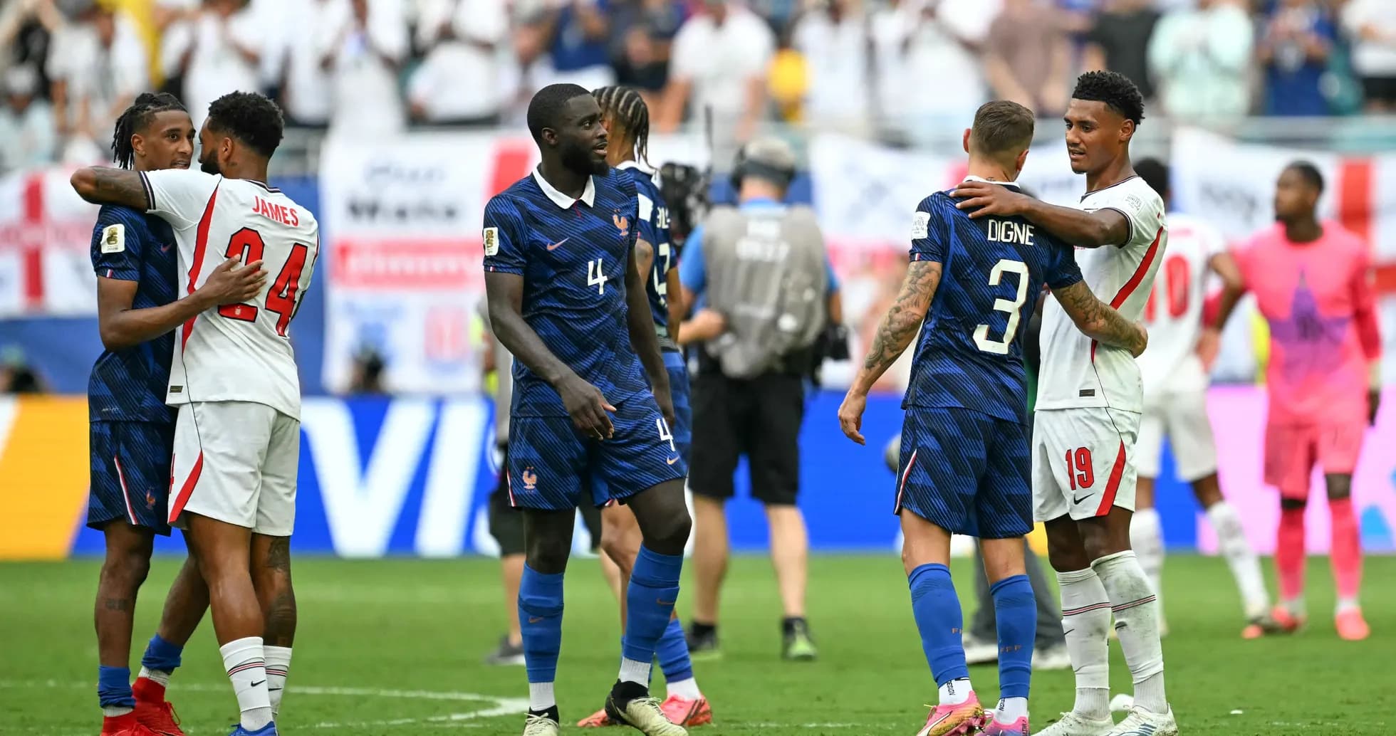 Players from France and England embracing after match