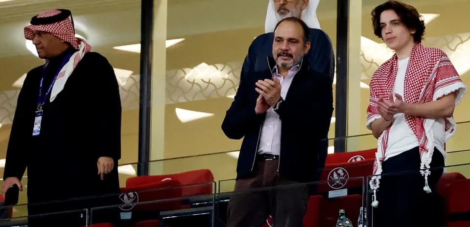 Group of spectators applauding in stadium box