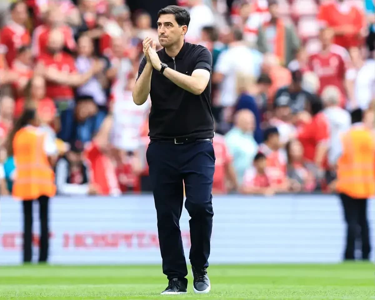 Manager applauding fans after the match
