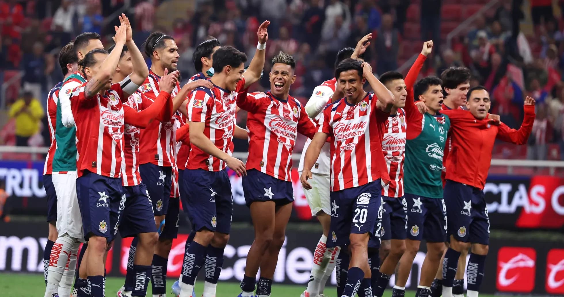 Chivas celebrating victory after Liga MX match