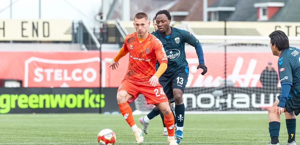 Player dribbling ball during Forge match