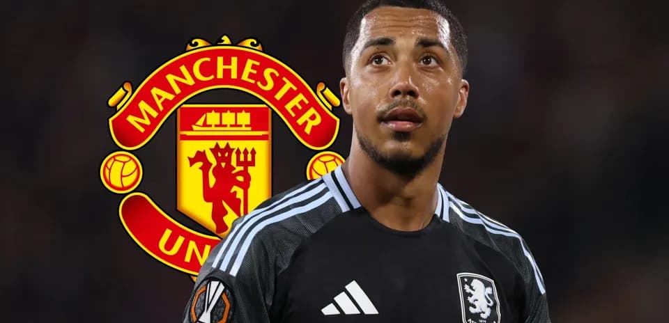 Aston Villa goalkeeper during match with Manchester United logo