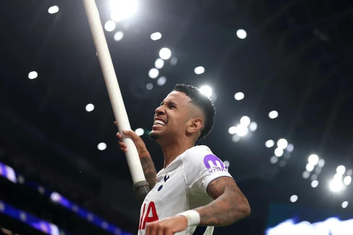 Player celebrating with a pole after a goal