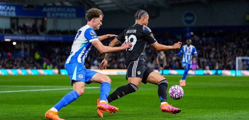 Leeds player tackled by Brighton opponent