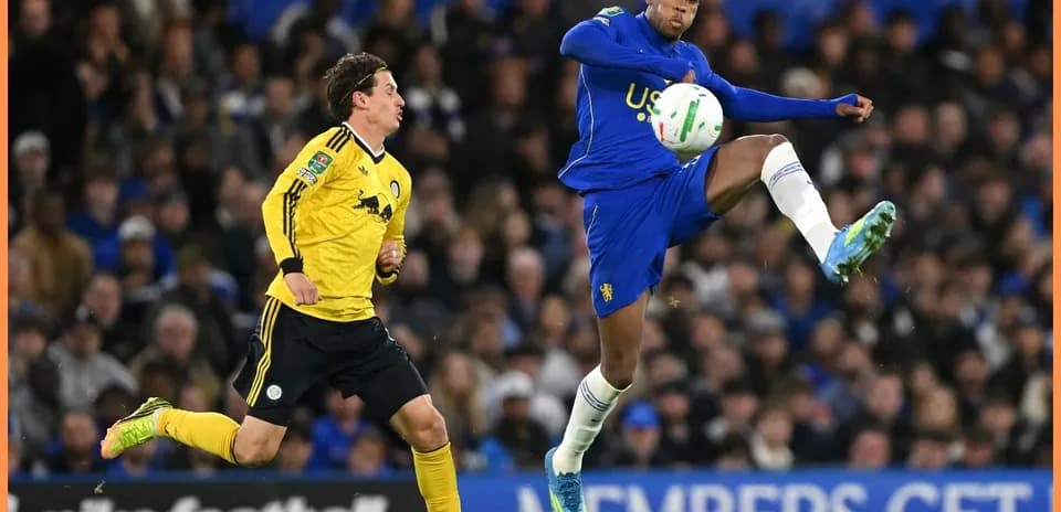 Player kicking the ball during a football match