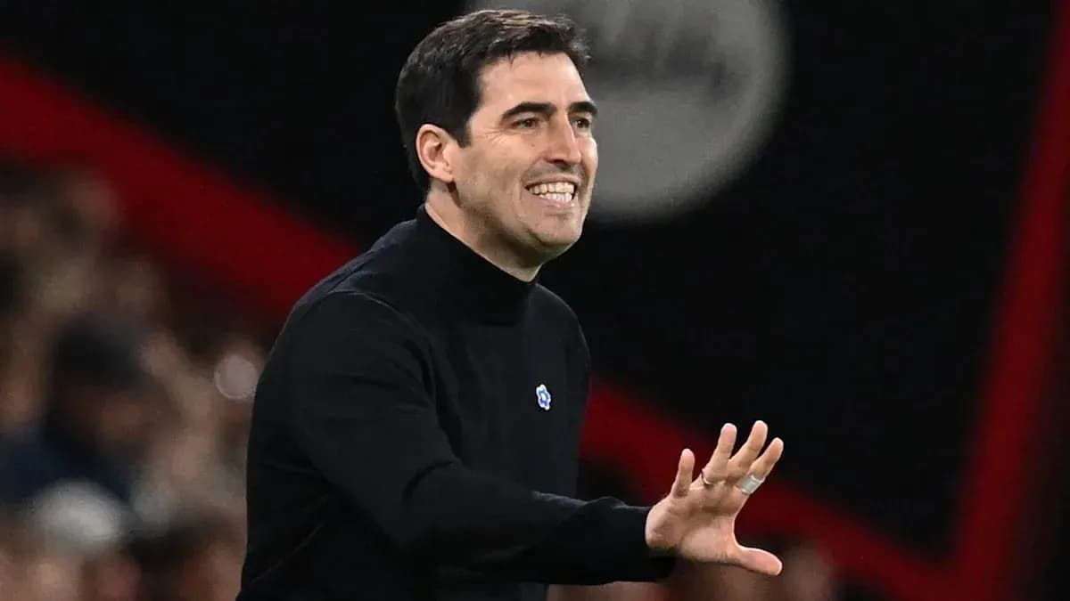 Coach gesturing during a match from the sidelines