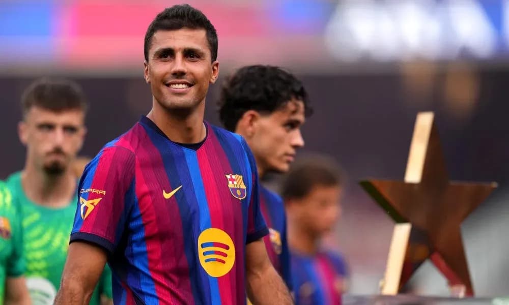 Player smiling with trophy during team celebration
