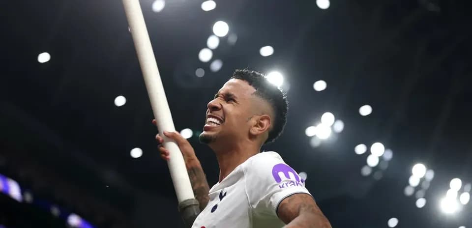 Player celebrating with a flag at stadium