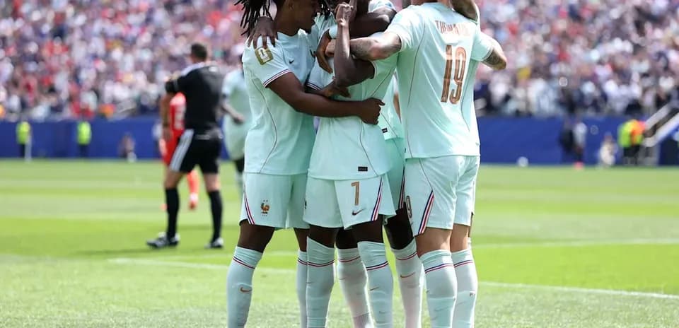 France players celebrating a goal on the field