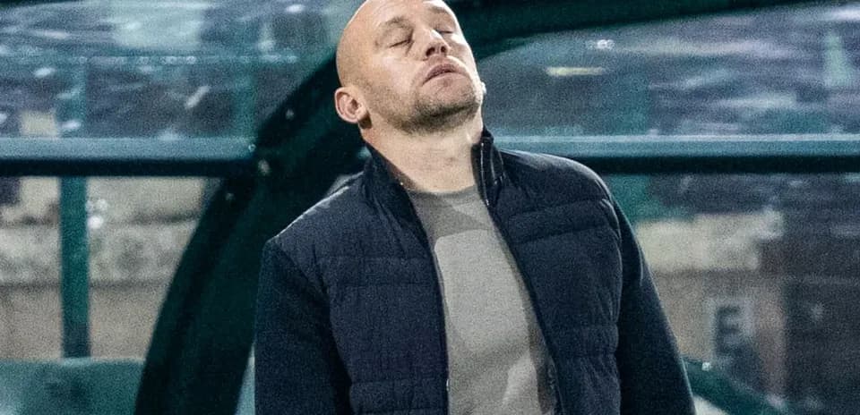 Coach looking frustrated on the sidelines