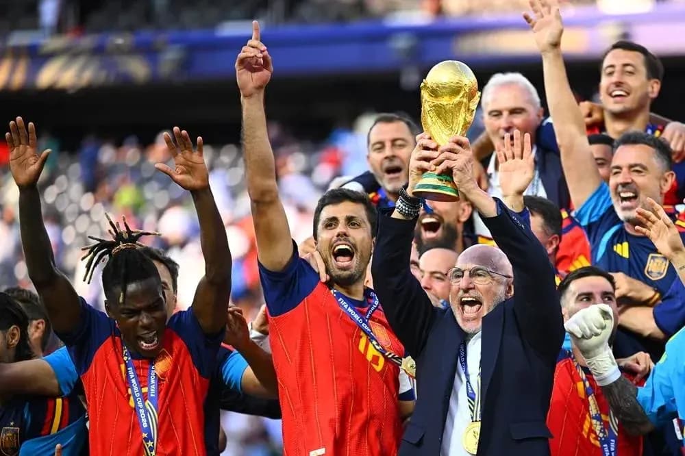 Team celebrating with FIFA World Cup trophy
