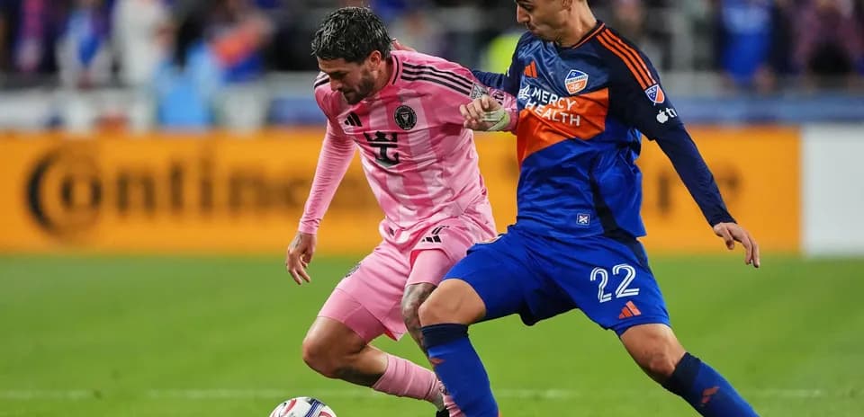 Two players competing for the ball during match