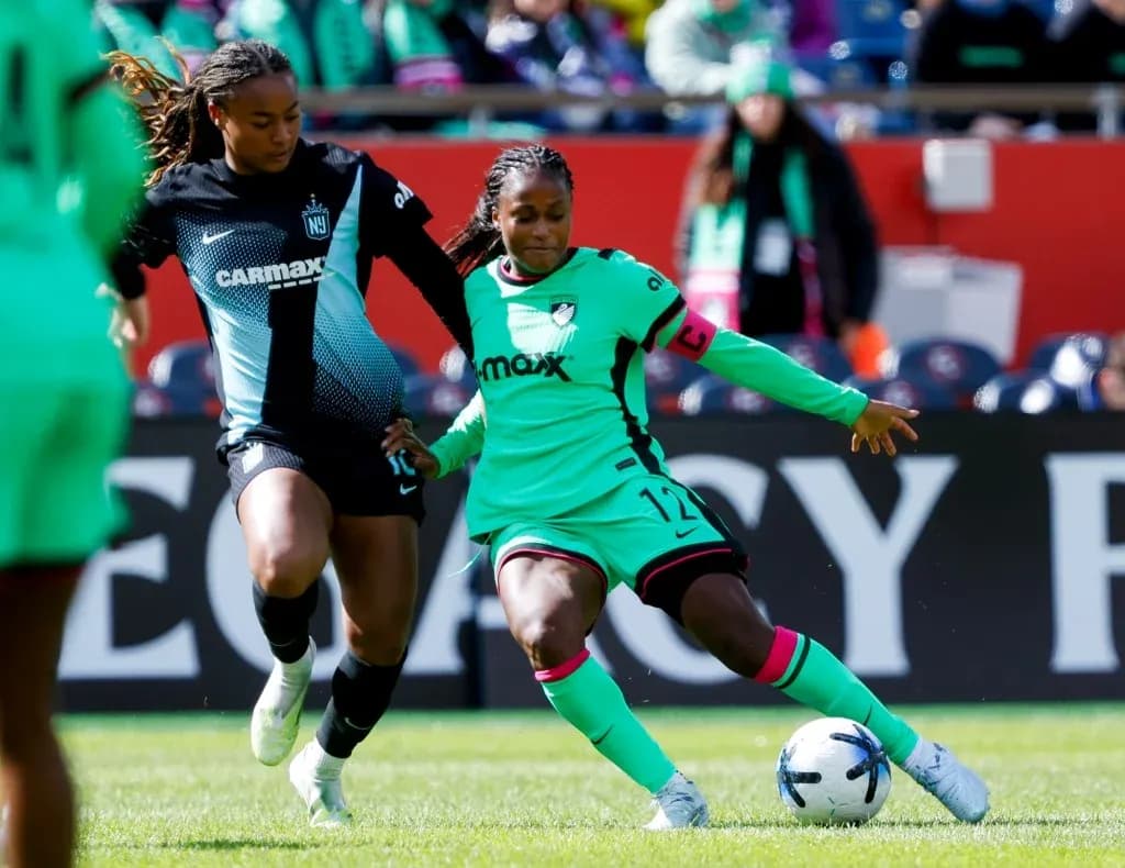 Two players competing for the ball during match