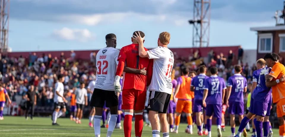 Players celebrating after a match in USL League One