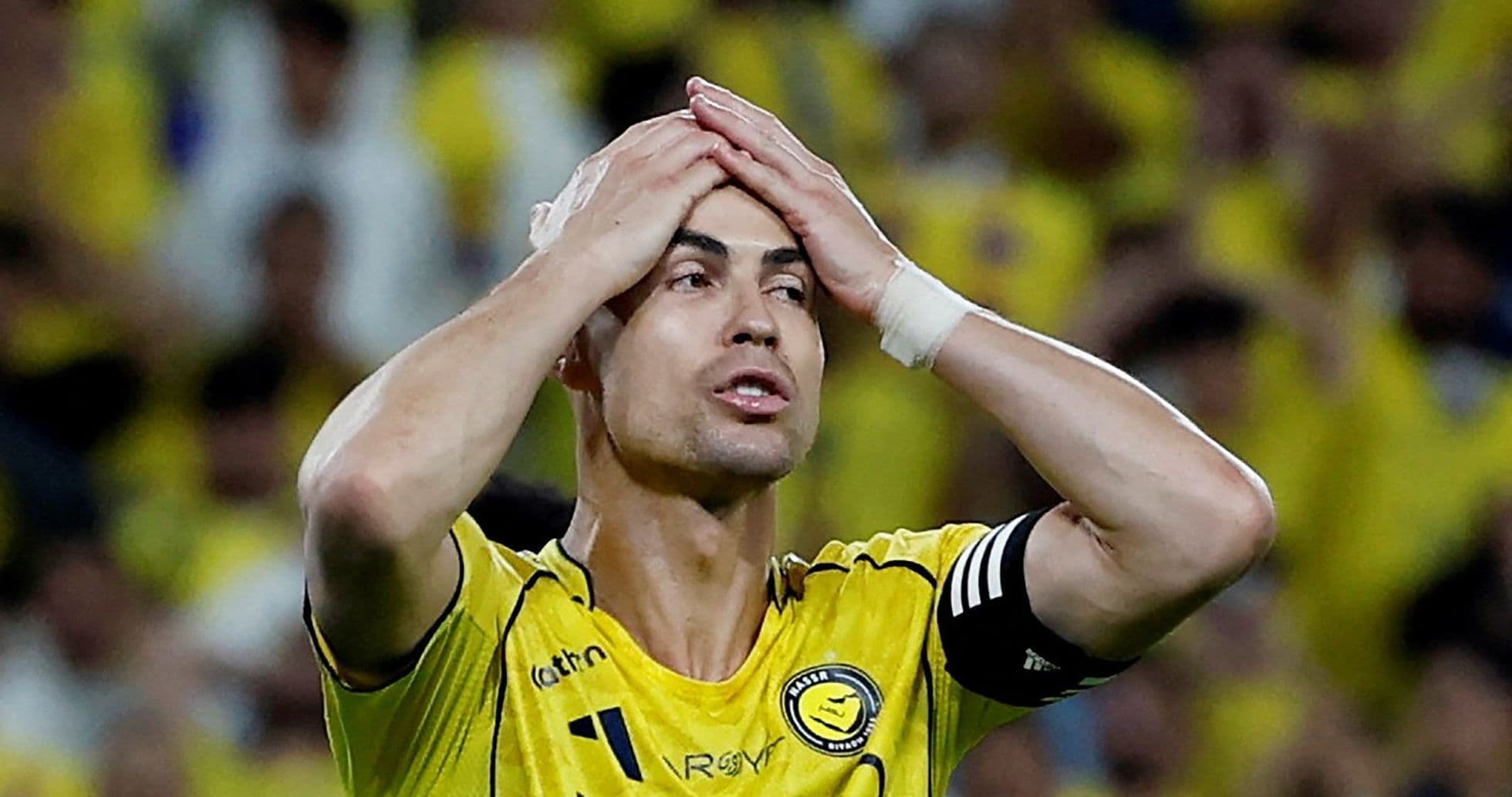 Player with hands on head during match action