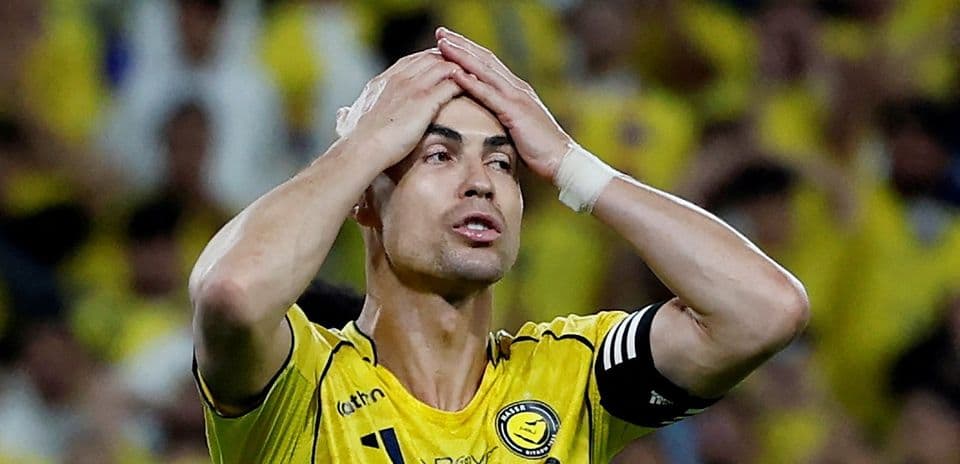 Player with hands on head during match action