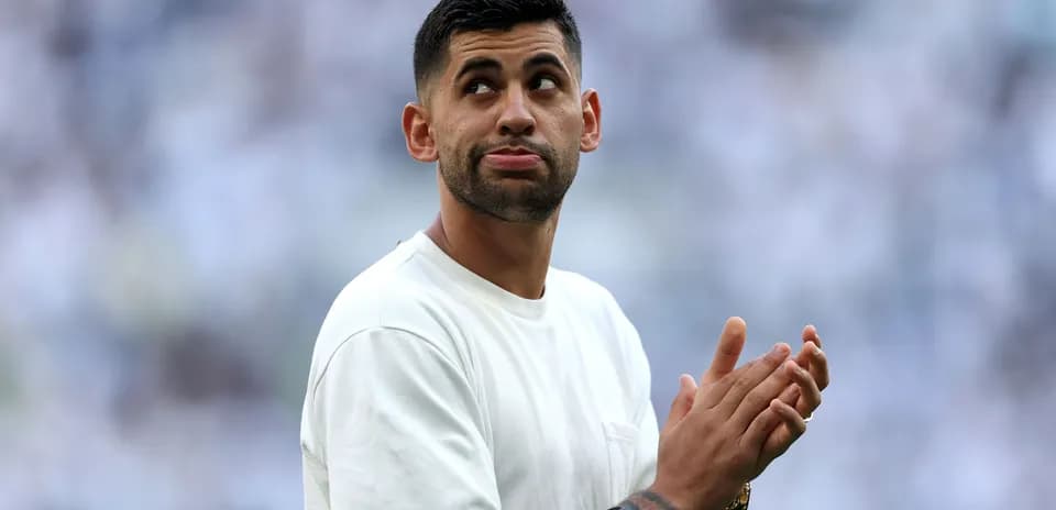 Player applauding fans during a match warm-up