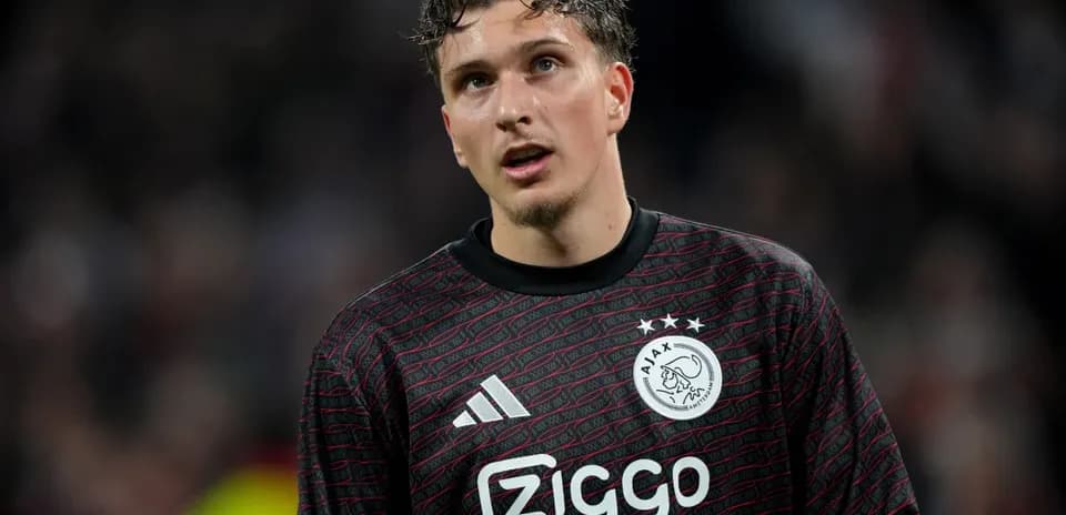 Goalkeeper in Ajax jersey during match action