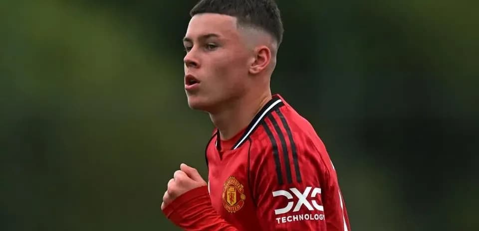 Young player in red Manchester United jersey during match