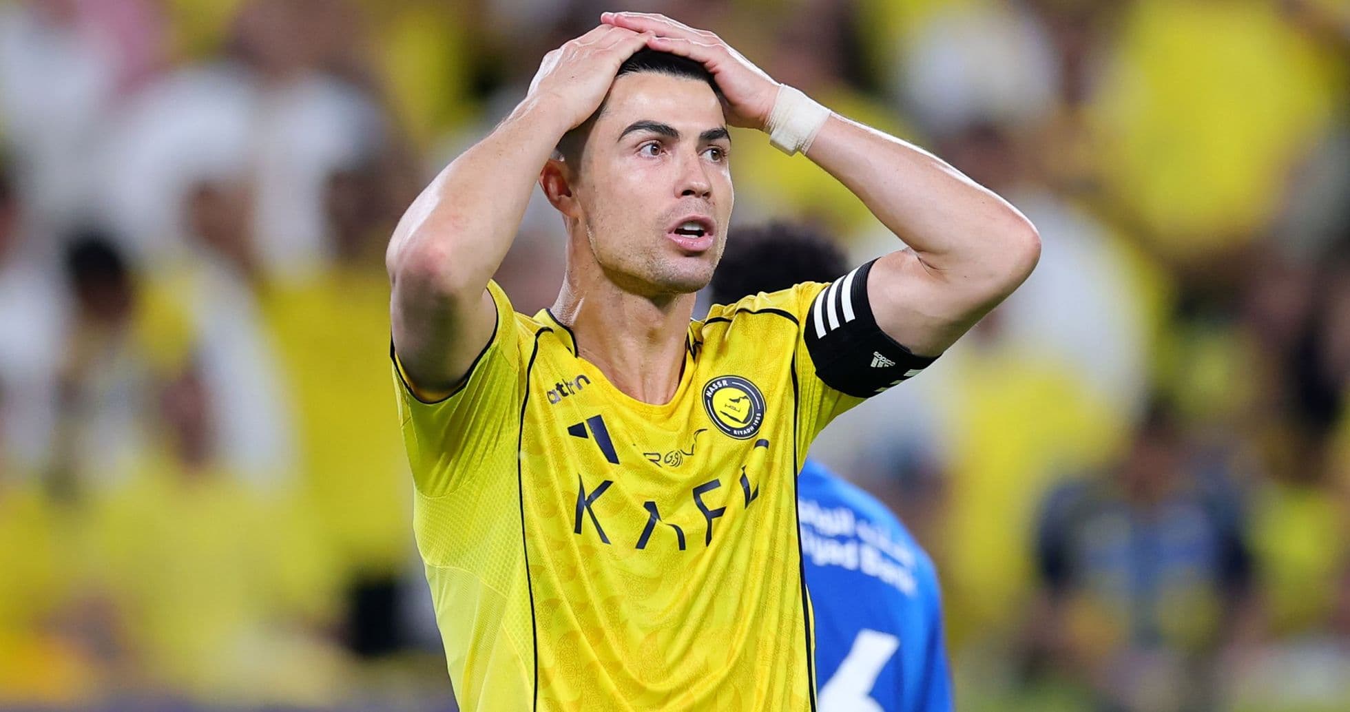 Player in yellow jersey reacting during a match
