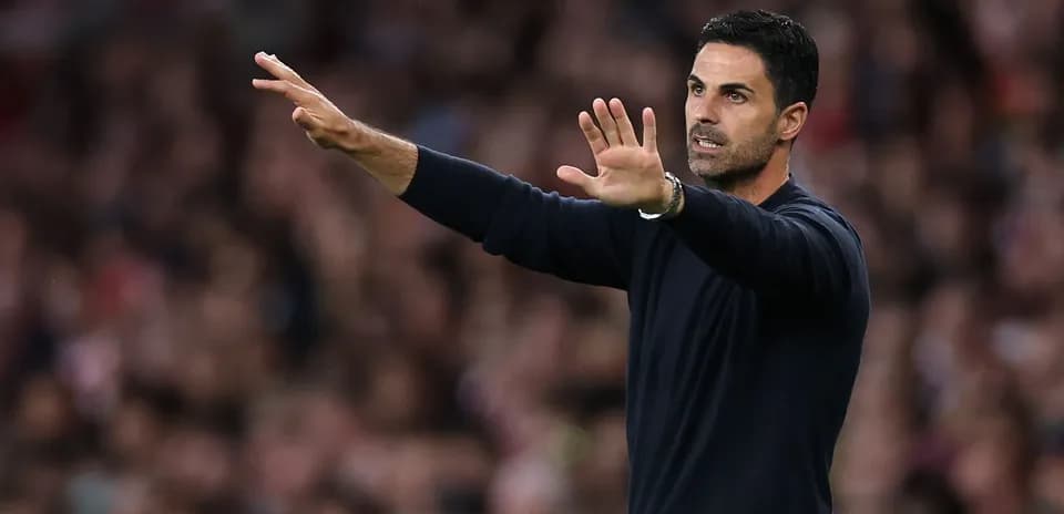 Manager gesturing during a football match