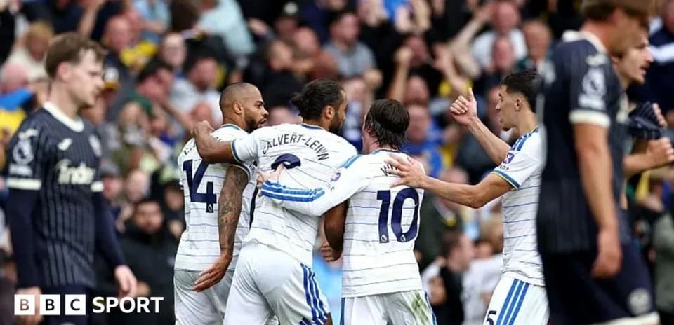Players celebrating a goal during a match